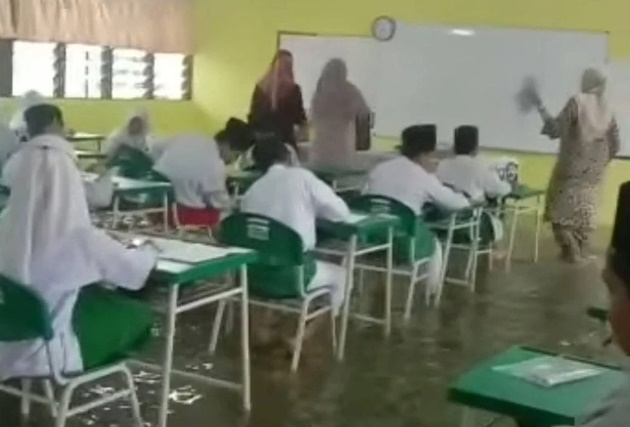 Murid SRA Tetap Duduki Peperiksaan UPKK Dalam Banjir Undang Kerisauan