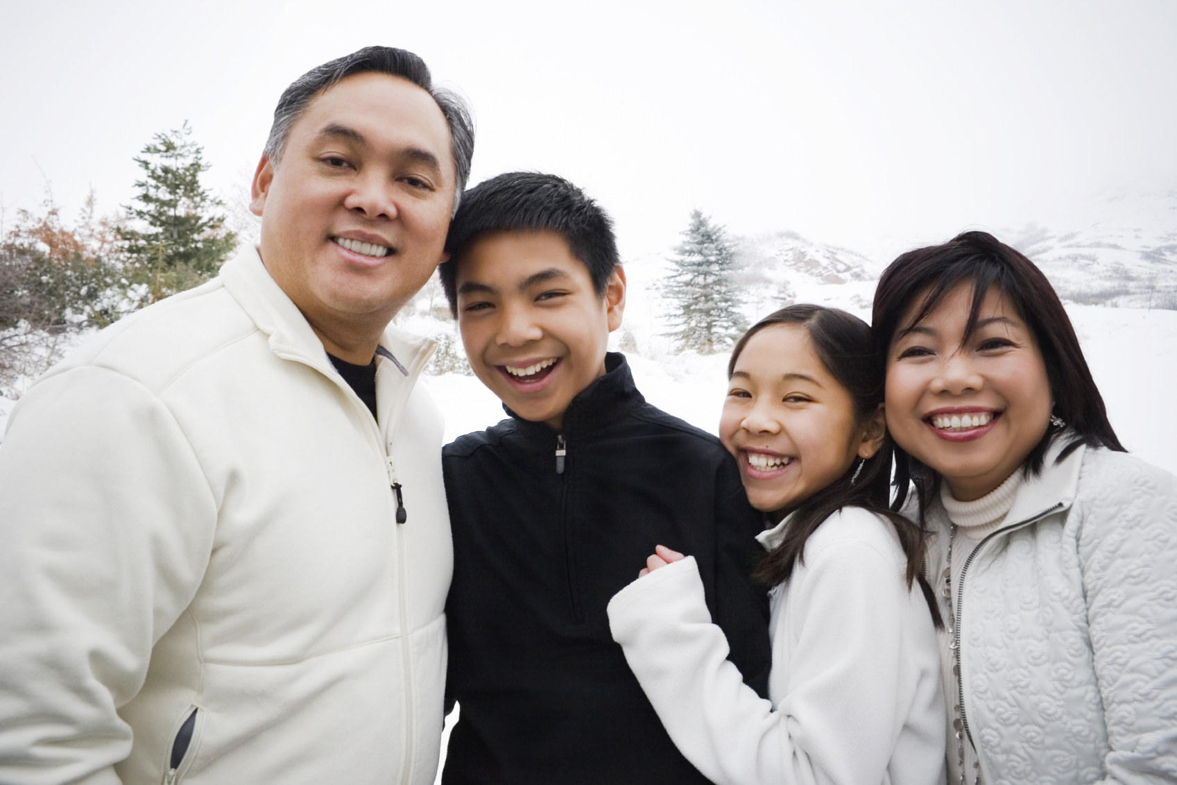 Winter portrait of a beautiful Asian family.